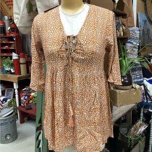 Sacred Threads rayon burnt orange & white animal print top. NWT